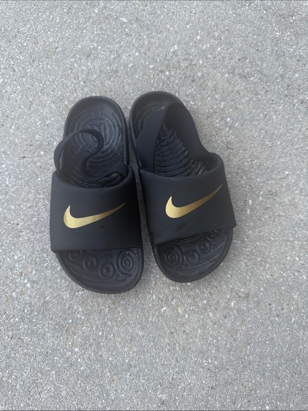 Nike Black Slides with Gold Swoosh